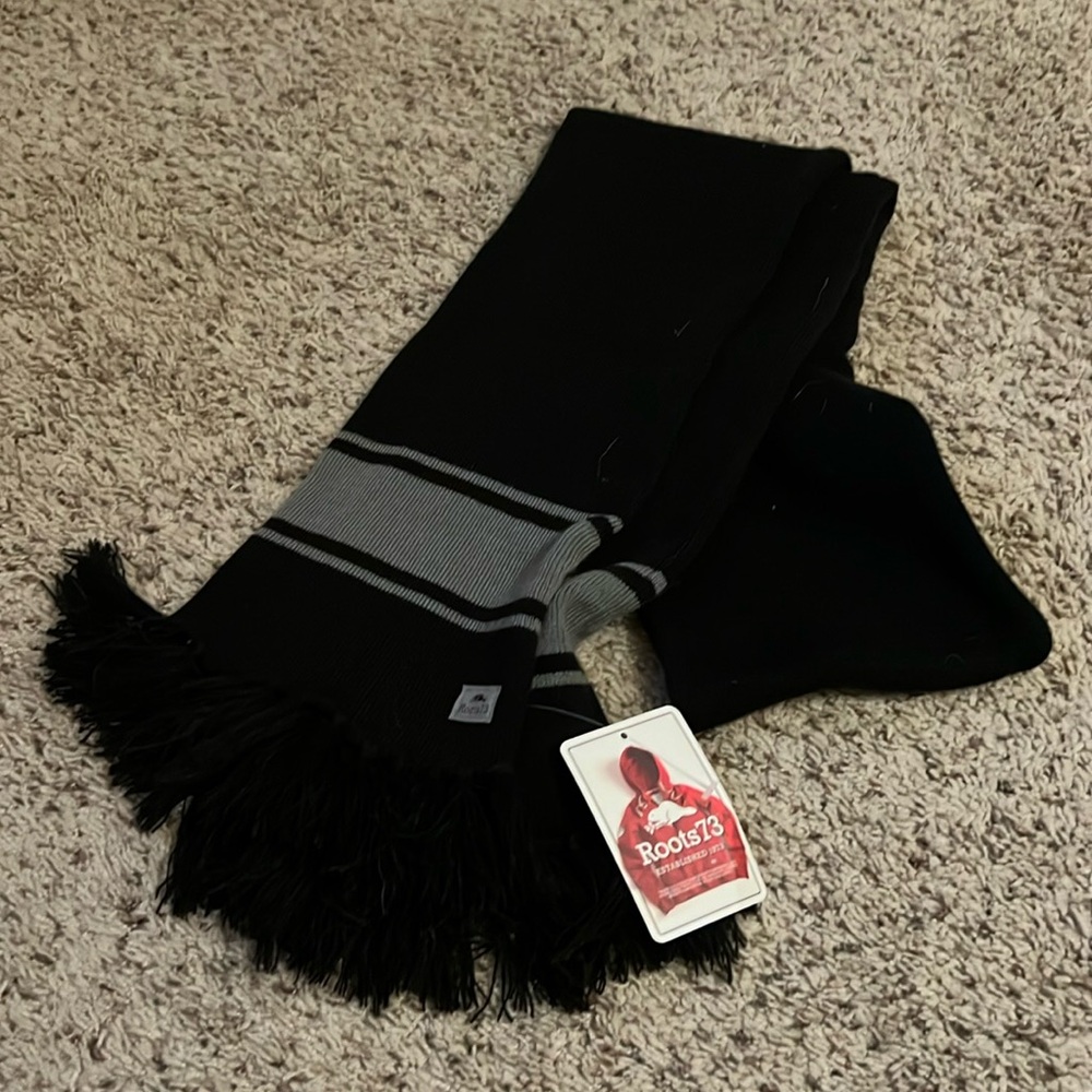 Black and grey scarf with black fringe Roots 73 64x7 1/2 inches
